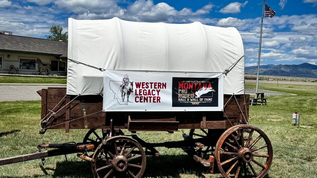 Western Legacy Center sign on an old covered wagon.
